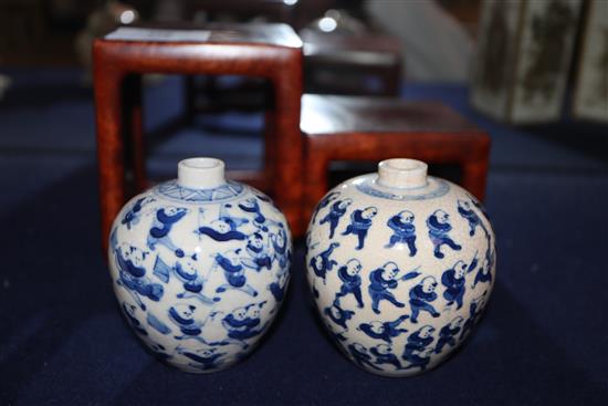 Two Chinese crackleglaze small blue and white vases, painted with figures, late 19th century plus wood scholars stand tallest 7cm